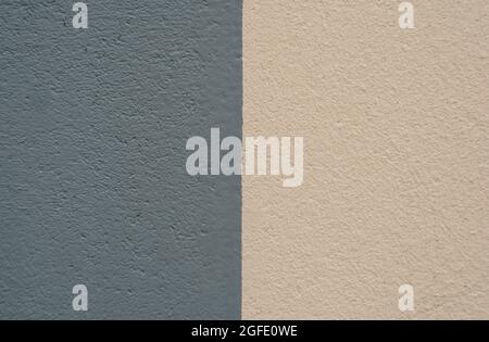 Close up of an old concrete and plaster wall in Honfleur, France, for an abstract background texture. Stock Photo