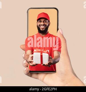 African Courier On Smartphone In Hand Giving Gift Box, Collage Stock Photo
