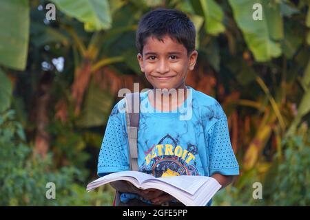 A student kid with books - child education concept Stock Photo