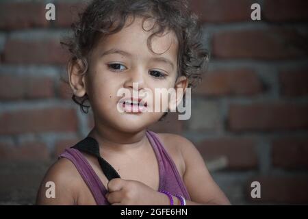 indian little girl cute exprission on face Stock Photo