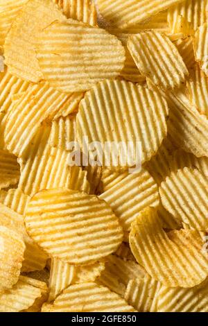 Salty Ruffled Potato Chips in a Bowl Stock Photo