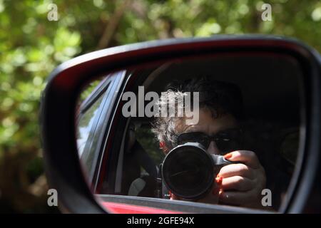 Southern Grenada Self Portrait in car wing mirror Stock Photo