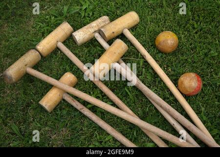 Antique Wooden Outdoor Croquet Set Wooden Mallets and Balls with woodworm Stock Photo