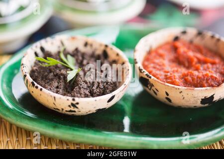 Harissa tomato paste and black olives paste. Appetiser, Morocco Stock Photo