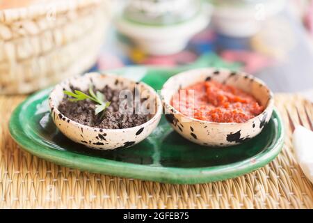 Harissa tomato paste and black olives paste. Appetiser, Morocco Stock Photo