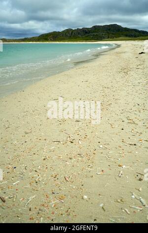 The shell beach at Reef in the Isle of Lewis with the tide line strewn with colourful shells. Stock Photo