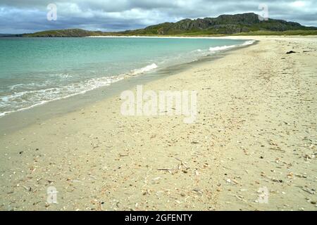 The shell beach at Reef in the Isle of Lewis with the tide line strewn with colourful shells. Stock Photo