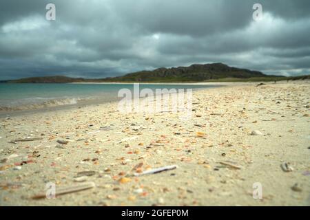 The shell beach at Reef in the Isle of Lewis with the tide line strewn with colourful shells. Stock Photo