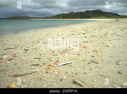 The shell beach at Reef in the Isle of Lewis with the tide line strewn with colourful shells. Stock Photo