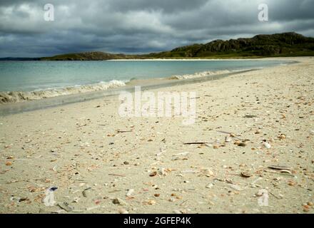 The shell beach at Reef in the Isle of Lewis with the tide line strewn with colourful shells. Stock Photo