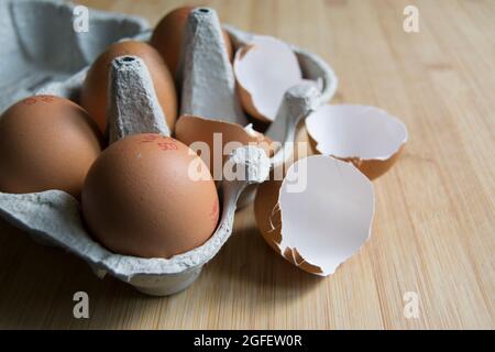 Brown speckled empty eggshells on the kitchen worktop Stock Photo