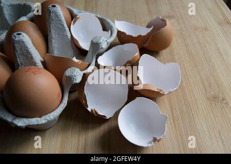 Brown speckled empty eggshells on the kitchen worktop Stock Photo