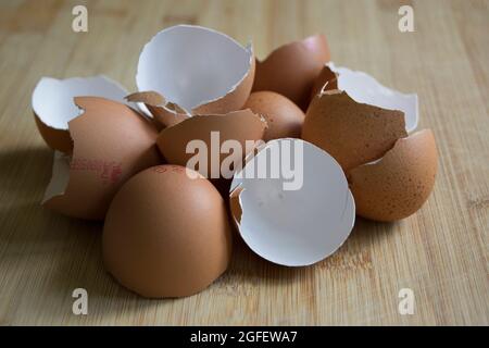 Brown speckled empty eggshells on the kitchen worktop Stock Photo