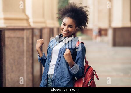 Cheerful African Student Girl Celebrating Passed Exam Gesturing Yes Outside Stock Photo