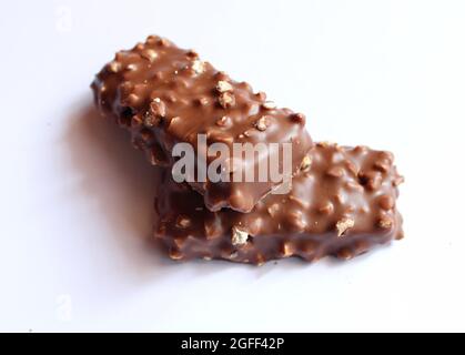 brown chocolate bar nuts one above the other Stock Photo