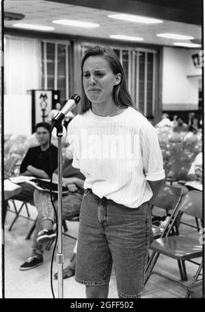 Austin Texas USA, circa 1991: Tearful high school student speaking at school board hearing to oppose the possible closure of her high school.  File EV3-0220  no mr  ©Bob Daemmrich Stock Photo