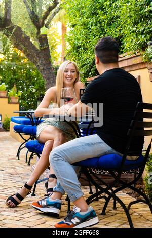 Couple eating on a patio Stock Photo