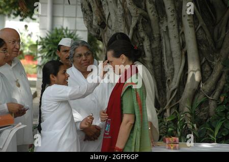 Asha, Director, Om Shanti Retreat Centre of the Brahma Kumari sect tying Rakhi to Sonia Gandhi, President of the Indian National Congress Party on the Stock Photo