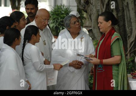 Asha, Director, Om Shanti Retreat Centre of the Brahma Kumari sect tying Rakhi to Sonia Gandhi, President of the Indian National Congress Party on the Stock Photo