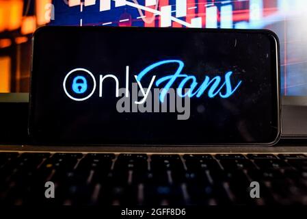 In this photo illustration the OnlyFans logo seen displayed on a