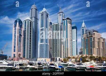 Dubai Marina with boats against skyscrapers in Dubai, United Arab Emirates Stock Photo