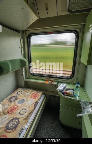 Single comfortable compartment in fast night car from Prague to Presov via Roznava in Slovakia Stock Photo