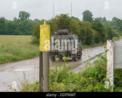 British army Panther 4x4 command and liaison vehicle in action on Salisbury Plain military training area, Wiltshire UK Stock Photo