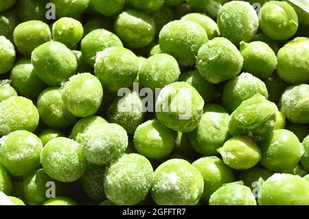 Fresh green frozen peas and grains, nutritious and healthy green vegetables Stock Photo