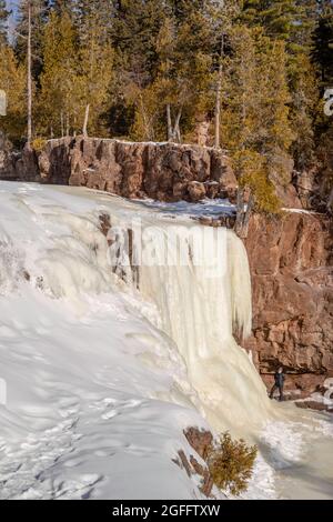 Frozen Gooseberry Falls on a cold January day; Gooseberry Falls State Park, Two Harbors, Minnesota, USA Stock Photo