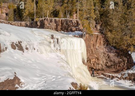 Frozen Gooseberry Falls on a cold January day; Gooseberry Falls State Park, Two Harbors, Minnesota, USA Stock Photo