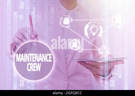 Handwriting text Maintenance Crew. Word for responsible for maintenance and repair work of buildings Lady In Uniform Touching And Using Futuristic Stock Photo