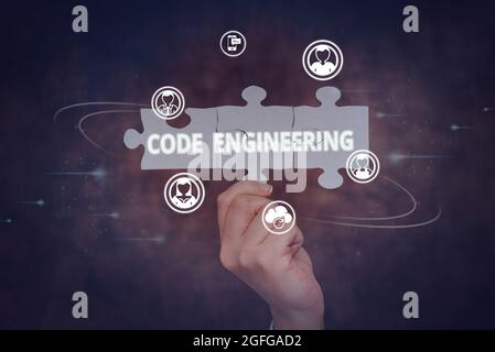 Sign displaying Code Engineering. Business approach application of engineering to the development of software Hand Holding Jigsaw Puzzle Piece Stock Photo