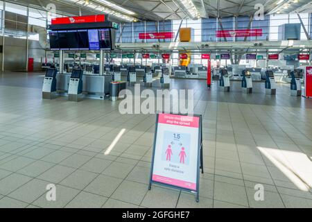 As Sydney, Australia, continues its lengthy coronavirus lockdown, Sydney Airport looks deserted due to closed borders and travel restrictions. Stock Photo