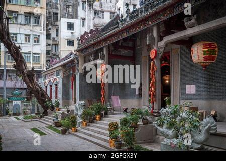 Pak Tai Temple in Wan Chai, Hong Kong Island, with lanterns, paper firecrackers and kumquat trees as decorations for Chinese New Year Stock Photo