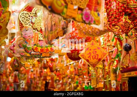 Chinese New Year decorations for sale on display in a shop in Sheung Wan, Hong Kong Island Stock Photo