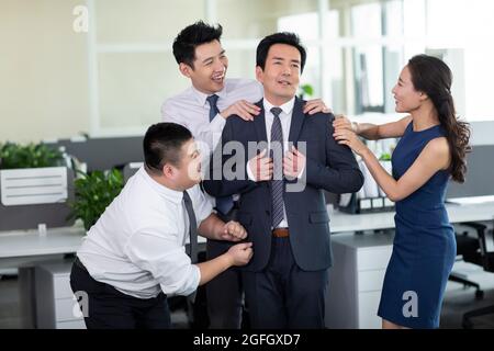 Employees flattering manager Stock Photo