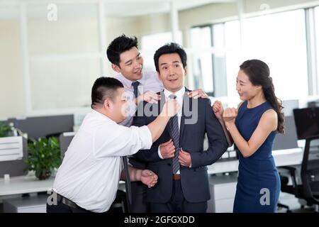Employees flattering manager Stock Photo
