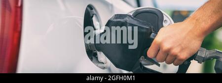 Gas station pump banner panorama. Man filling gasoline fuel in car holding nozzle. Petrol price. Close up Stock Photo