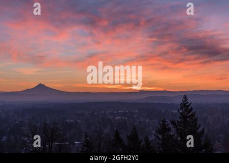 Colorful sunrise sky over Mt Hood and Portland Oregon, Pacific Northwest United States Stock Photo