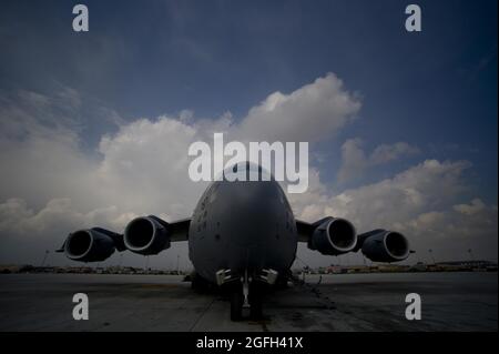 A C-17 Globemaser III from 816th Expeditionary Airlift Squadron waits to be loaded with more cargo after completeing an air delivery mission. The C-17 aircrew air delivered cargo that consisted of fuel and other various supplies to a remote forward operating base in Afghanistan. Stock Photo