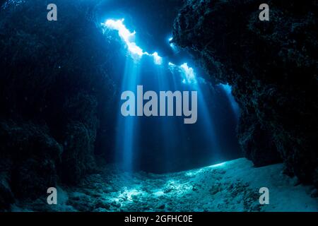 Rays of sunlight into the underwater cave Stock Photo