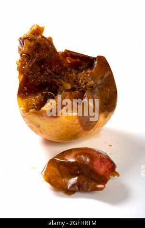 angle view badly rotten apple with worms on a white background Stock ...