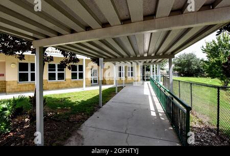 Celebration, United States. 25th Aug, 2021. The Celebration K-8 School near Walt Disney World in Florida is seen after being closed for the remainder of the week due to safety concerns following a surge in COVID-19 cases among students and staff. Classes were moved to virtual learning after several hundred kids and a number of teachers were placed in quarantine. Credit: SOPA Images Limited/Alamy Live News Stock Photo