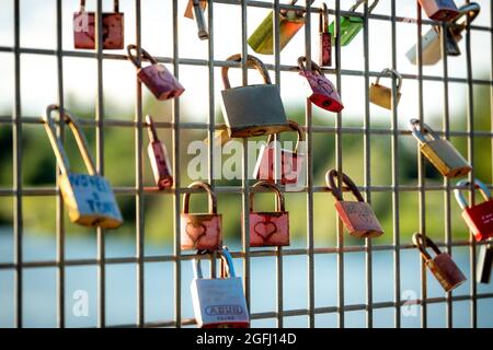 Love Locks on the Bridge above the Flueckiger Lake in Freiburg Stock Photo