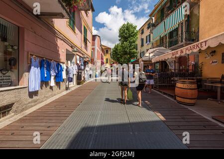 Street in Monterosso al Mare village with shops and restaurants, tourist resort in Cinque Terre National park in Liguria, La Spezia, Italy, Europe. Stock Photo