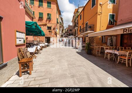 Street in Monterosso al Mare village with shops and restaurants, tourist resort in Cinque Terre National park in Liguria, La Spezia, Italy, Europe. Stock Photo