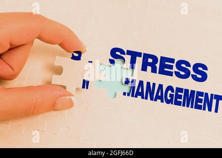 Text sign showing Stress Management. Word Written on learning ways of behaving and thinking that reduce stress Building An Unfinished White Jigsaw Stock Photo