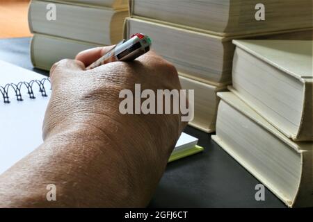 writing on a notebook Stock Photo