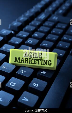 Hand writing sign Agile Marketing. Word Written on focusing team efforts that deliver value to the endcustomer Typing Online Website Informations Stock Photo
