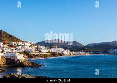 Landscape of the coastal area Cabo de Gata, province of Almeria, Andalucia, Spain. The village of San Jose and its whitewashed houses along the Medite Stock Photo